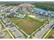 Aerial view of the community featuring a pool, a basketball court, and a large park at 11720 Language Way, Orlando, FL 32832