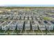 Aerial view of a neighborhood featuring single-Gathering homes with solar panels at 11720 Language Way, Orlando, FL 32832