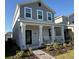 Charming two-story home with a covered porch and well-maintained landscaping at 11720 Language Way, Orlando, FL 32832