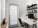 Bright home office featuring modern desk and shelving at 11720 Language Way, Orlando, FL 32832