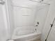 This is an enclosed bathtub with white walls and white tub and shower at 2846 Club Cortile Cir, Kissimmee, FL 34746