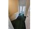 Hallway with carpeted floor and neutral walls leading to multiple rooms at 2846 Club Cortile Cir, Kissimmee, FL 34746