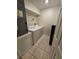 A laundry room featuring a washer, dryer, and shelving for storage at 2846 Club Cortile Cir, Kissimmee, FL 34746