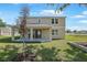 A covered patio and grassy backyard, perfect for outdoor entertaining and relaxation at 3709 Deer Ridge Dr, Mount Dora, FL 32757
