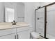 Clean bathroom featuring a glass shower stall, white cabinetry, and quartz countertops at 3709 Deer Ridge Dr, Mount Dora, FL 32757