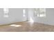 Bright, empty bedroom featuring tile floors and natural light from three windows at 3709 Deer Ridge Dr, Mount Dora, FL 32757