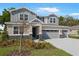 Charming two-story home with a well-manicured lawn and a three car garage at 3709 Deer Ridge Dr, Mount Dora, FL 32757