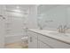 Bathroom with double sinks, a full bathtub, and a shower with white tile at 3716 Deer Ridge Dr, Mount Dora, FL 32757