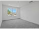 Bedroom with neutral carpet, a large window, recessed lighting, and neutral paint at 3716 Deer Ridge Dr, Mount Dora, FL 32757