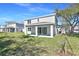An inviting backyard with a covered patio and lush green grass at 3764 Deer Ridge Dr, Mount Dora, FL 32757