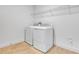A well-equipped laundry room with a modern washer and dryer on tile flooring at 3764 Deer Ridge Dr, Mount Dora, FL 32757