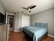 Bright bedroom with wood floors, ceiling fan, and a spacious closet at 824 San Pedro Ct, Kissimmee, FL 34758