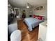 Cozy bedroom featuring wood floors, a ceiling fan, and ample closet space at 824 San Pedro Ct, Kissimmee, FL 34758