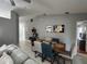 Modern dining room with wood table, stylish seating, and contemporary wall art at 824 San Pedro Ct, Kissimmee, FL 34758