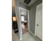Hallway view into a bedroom with wood floors and natural light at 824 San Pedro Ct, Kissimmee, FL 34758