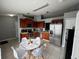 Modern kitchen with stainless steel appliances and eat-in dining area at 824 San Pedro Ct, Kissimmee, FL 34758