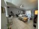 Open-concept living area featuring tile flooring, sliding glass doors, and lots of natural light at 824 San Pedro Ct, Kissimmee, FL 34758