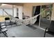 Relaxing outdoor patio featuring a white hammock and comfortable seating at 824 San Pedro Ct, Kissimmee, FL 34758
