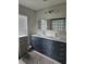 Stylish bathroom featuring a double sink vanity, modern lighting, and neutral color palette at 1060 Rock Harbor Ave, Orlando, FL 32828