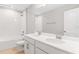 Bright bathroom featuring double sinks, chrome fixtures, shower and tub, and light neutral paint at 1455 August Gray Dr, Kissimmee, FL 34744
