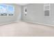 Bright bedroom with large windows and neutral-colored flooring at 1455 August Gray Dr, Kissimmee, FL 34744