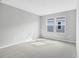 Bright bedroom with plush carpeting, natural light and neutral color scheme at 1455 August Gray Dr, Kissimmee, FL 34744