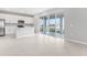 Kitchen with breakfast bar area leading to a large outdoor patio with lake view at 1455 August Gray Dr, Kissimmee, FL 34744