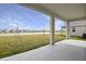Covered patio overlooking a pond at 1461 August Gray Dr, Kissimmee, FL 34744