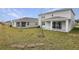 Large backyard with patio and trees at 1461 August Gray Dr, Kissimmee, FL 34744