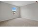 Well-lit bedroom with window and neutral wall at 1461 August Gray Dr, Kissimmee, FL 34744
