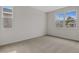 Bright bedroom with neutral carpeting and multiple windows at 1461 August Gray Dr, Kissimmee, FL 34744