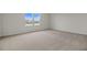 Well-lit bedroom with large window overlooking lake at 1461 August Gray Dr, Kissimmee, FL 34744