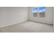 Spacious bedroom with neutral wall and carpeting, two windows at 1461 August Gray Dr, Kissimmee, FL 34744