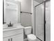 Bathroom featuring a walk in shower, white vanity, and a neutral color scheme at 1479 August Gray Dr, Kissimmee, FL 34744