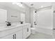 Modern bathroom featuring a double vanity, shower, and contemporary fixtures at 1479 August Gray Dr, Kissimmee, FL 34744