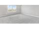 Bright bedroom with carpet floors, two windows with a water view at 1479 August Gray Dr, Kissimmee, FL 34744