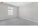 Cozy bedroom featuring carpet floors, one window, and neutral walls at 1479 August Gray Dr, Kissimmee, FL 34744