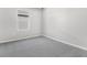 Empty bedroom featuring soft carpet, a large window, and neutral decor at 1479 August Gray Dr, Kissimmee, FL 34744
