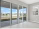 Bright living space featuring a large sliding glass door with a beautiful water view at 1479 August Gray Dr, Kissimmee, FL 34744