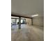 Spacious unfinished basement with concrete floors, concrete block walls, support beams and natural light at 2728 Adair Rd, Davenport, FL 33837