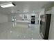 Open kitchen with new appliances, island, and white cabinets at 2728 Adair Rd, Davenport, FL 33837