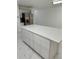 Spacious kitchen island featuring white cabinets and a stone countertop at 2728 Adair Rd, Davenport, FL 33837