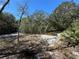 Beautiful vacant homesite offering endless potential, featuring a mix of sandy soil and mature trees creating a peaceful setting at 2728 Adair Rd, Davenport, FL 33837