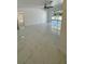 Spacious living room with modern tile flooring and a ceiling fan at 2728 Adair Rd, Davenport, FL 33837