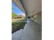 Covered porch with concrete flooring and view of the backyard at 2728 Adair Rd, Davenport, FL 33837