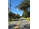 A yellow striped road leads to the property at 2728 Adair Rd, Davenport, FL 33837