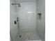 Newly renovated shower with stylish tile and a built-in shower niche at 2728 Adair Rd, Davenport, FL 33837