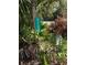 Property address displayed on a green street sign surrounded by lush greenery and foliage at 2728 Adair Rd, Davenport, FL 33837