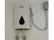 Close up of a tankless Marey water heater mounted to a wall at 2728 Adair Rd, Davenport, FL 33837