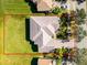 An aerial view of a single Gathering home that features a tile roof and a green manicured lawn at 3643 Weatherfield Dr, Kissimmee, FL 34746